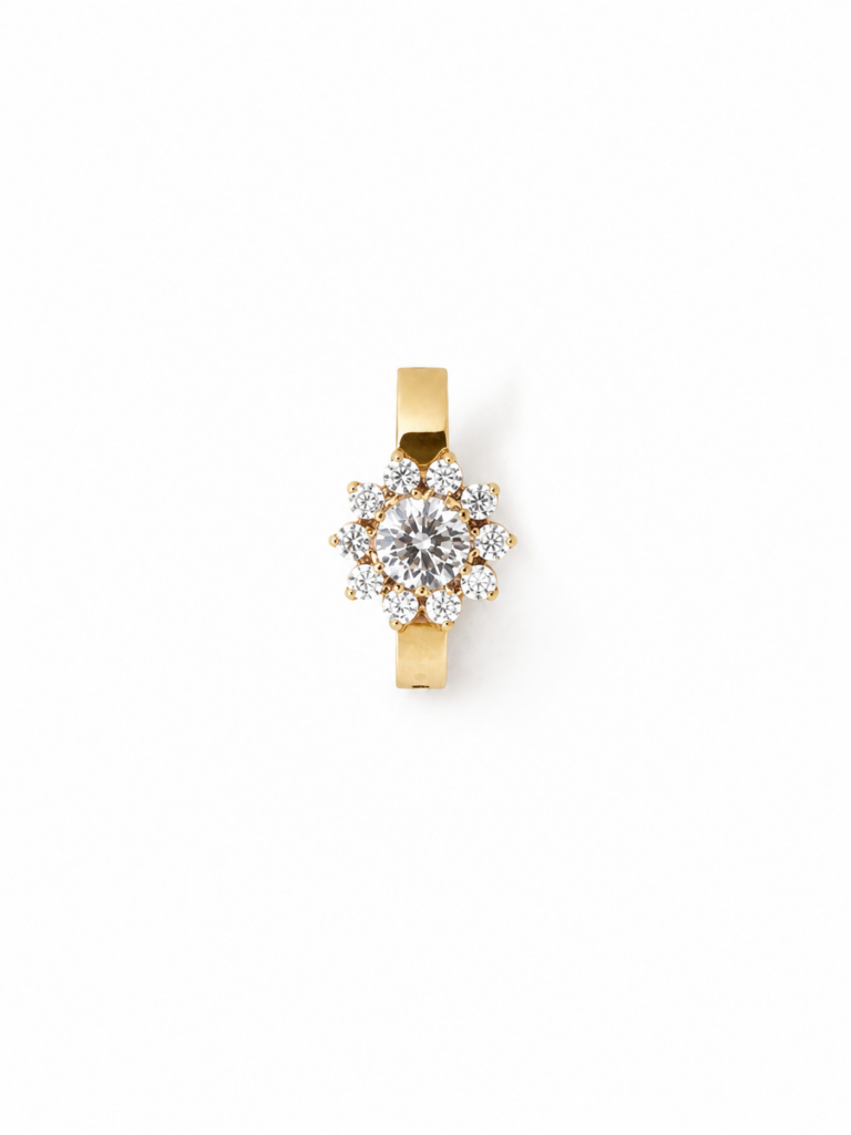 Piercing de nombril doré en titane ASTM F-136, orné d’un motif floral serti de zirconias premium.