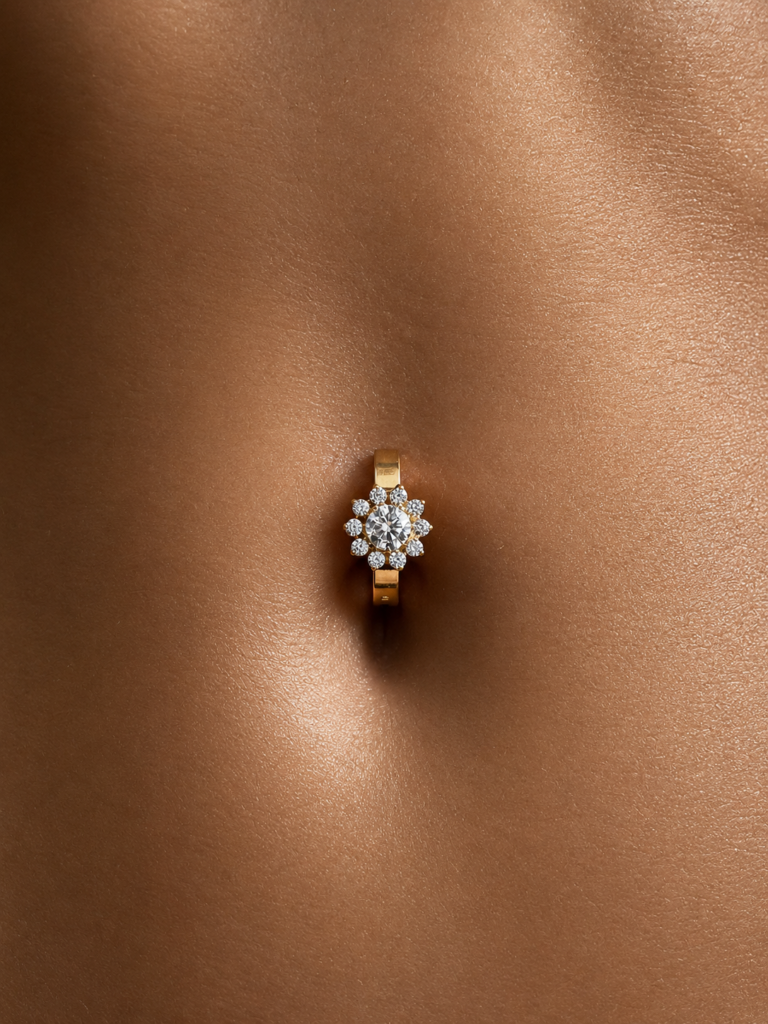 Piercing de nombril doré en titane ASTM F-136, orné d’un motif floral serti de zirconias premium.