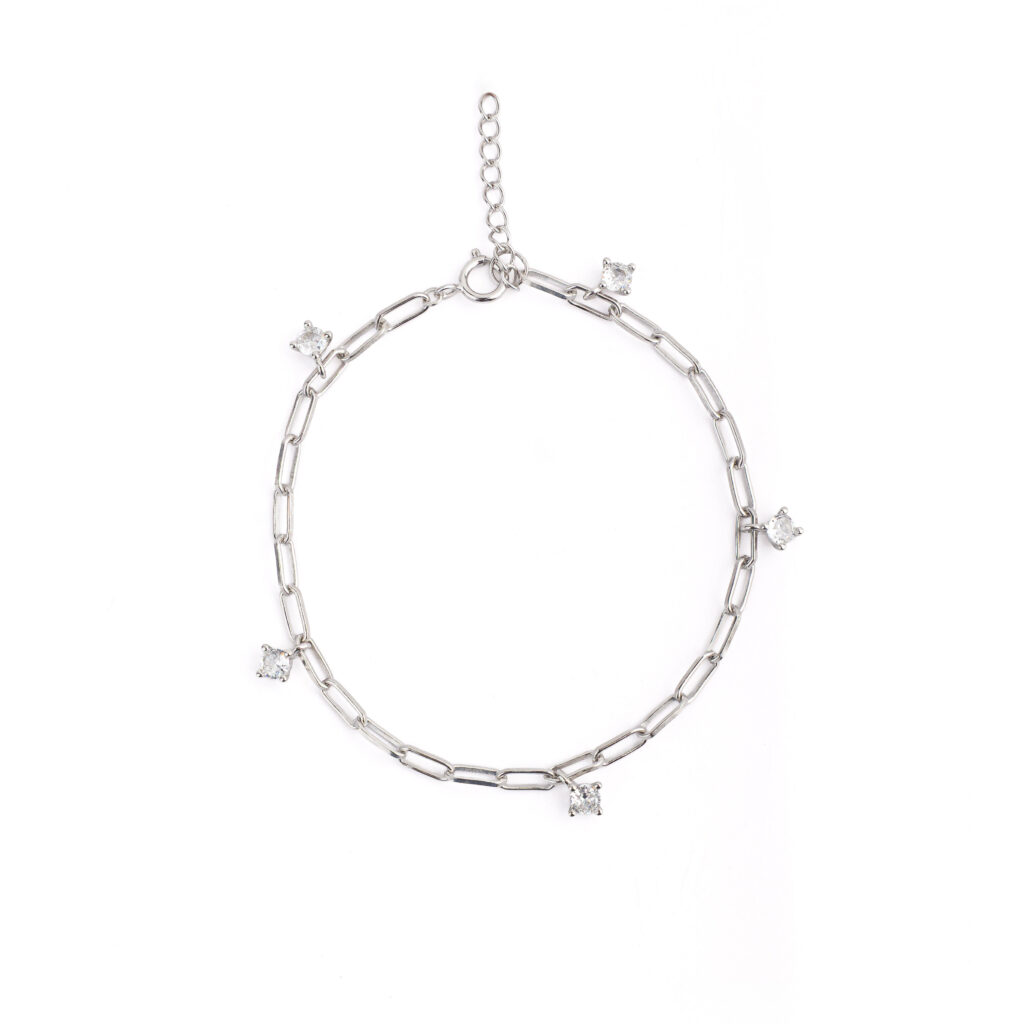 NOXY bracelet in 925 sterling silver, available in silver-tone or gold-tone finishes, adorned with white cubic zirconia delicately suspended along the chain.