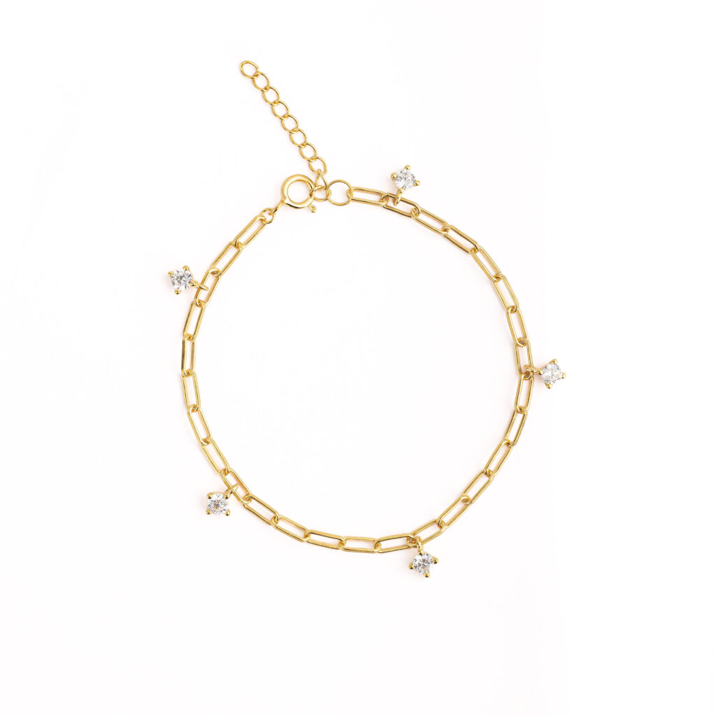 NOXY bracelet in 925 sterling silver, available in silver-tone or gold-tone finishes, adorned with white cubic zirconia delicately suspended along the chain.