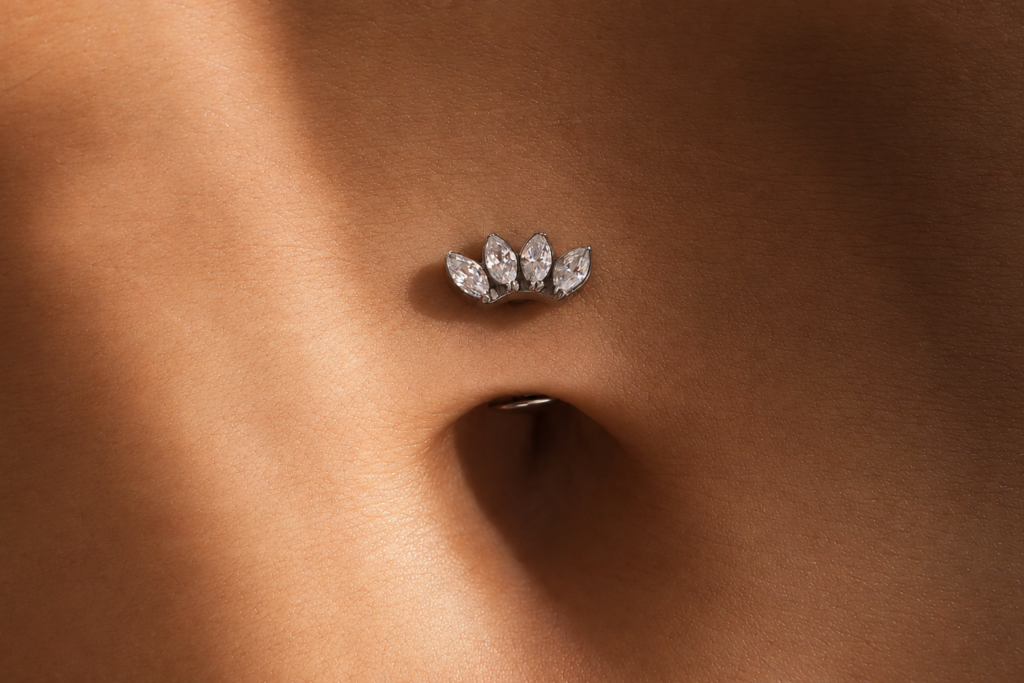 NOXA titanium piercing with marquise-cut zirconia, available in a silver or gold finish.
